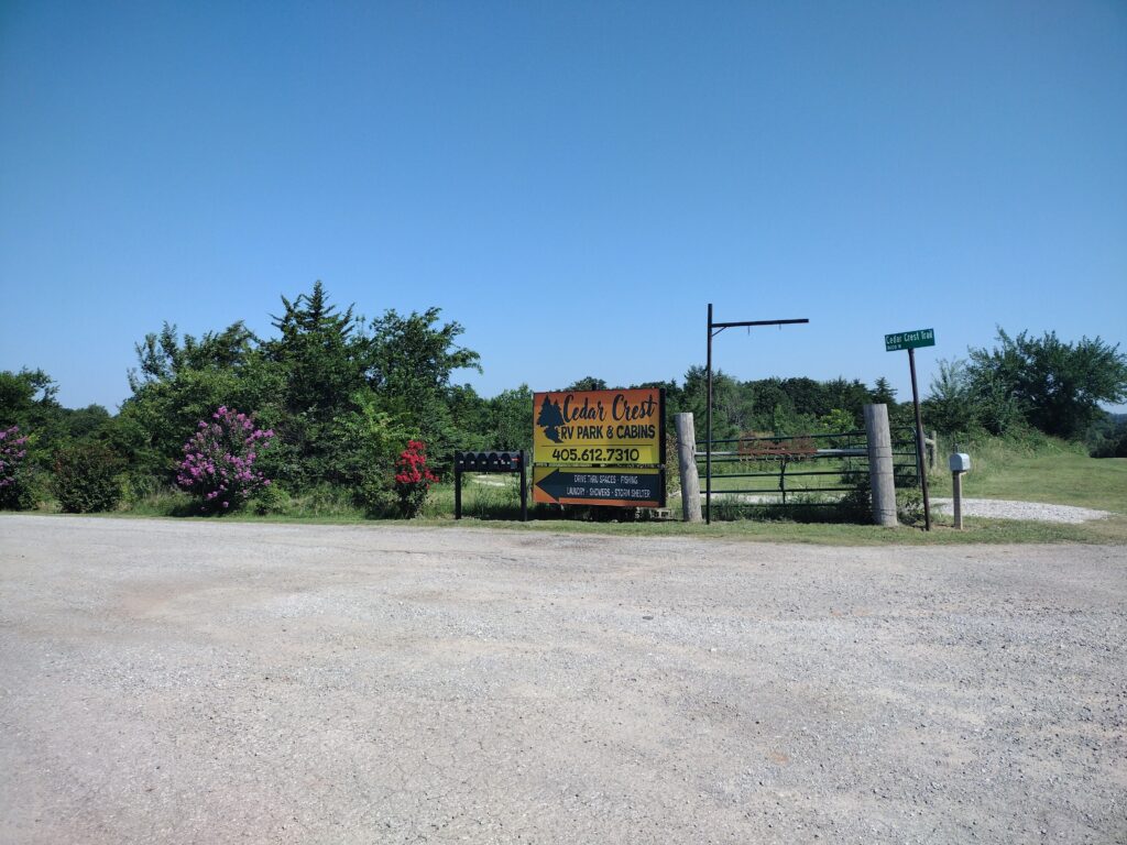Cedar Crest RV Park & Cabins sign and street sign